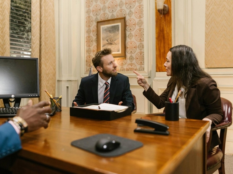 IT consultant reviewing technology strategy with business owner in London office - it consultancy